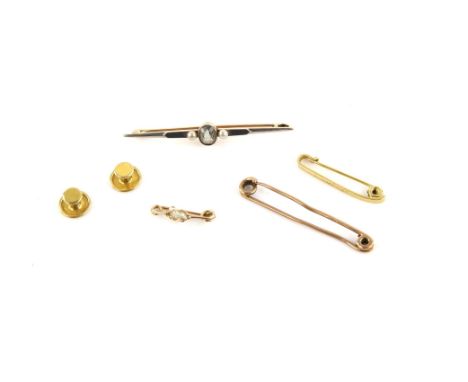 Four brooches, including an aquamarine and pearl bar brooch in 15 ct, a safety pin bar brooch in 9 ct, a bar brooch engraved 