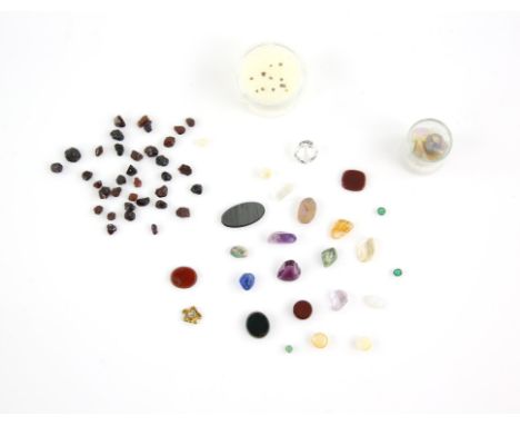 A group of loose gemstones, including bloodstone, hematite, carnelian, rock crystal, amethyst, a 10.7 x 10.07mm colourless to
