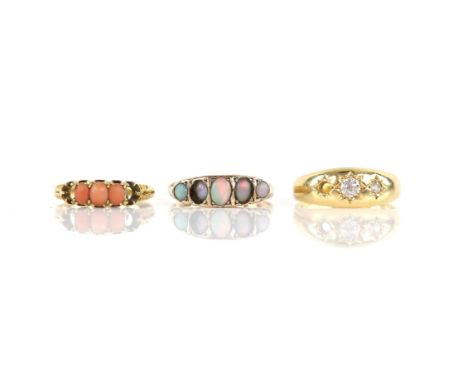 Three rings, one gypsy set with old cut diamonds, mounted in 18 ct, ring size R 1/2, another set with cabochon cut coral, mou