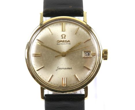 Omega A Gentleman's Seamaster gold top wristwatch, the signed dial with baton hour markers, date at three, fitted with a sign