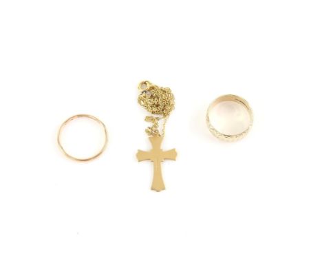 Two gold rings, one wide with engraved detail, 7.4mm width, another court ring, size T and a cross pendant and chain, all in 