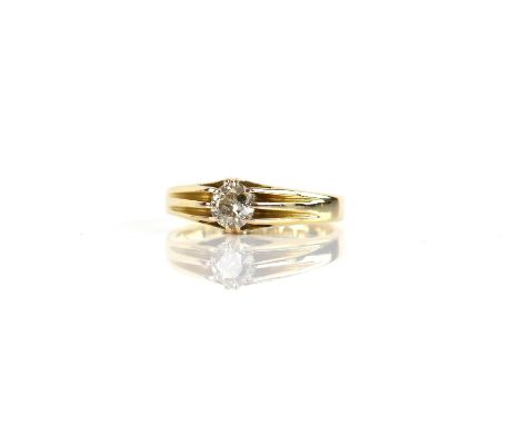 Early 20th C diamond ring, old cut diamond weighing an estimated 0.65 carat, claw set in a wide tapering band, hallmarked 18 