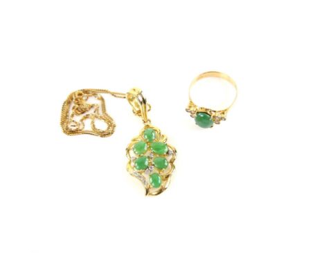 Jade and diamond ring, central oval cabochon cut jade, 8.9 x 7.1mm, with diamond set shoulders, mount stamped 14 ct, ring siz