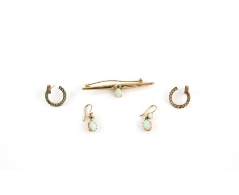 Opal earrings, each with two oval cabachon opals on each, mounted in 18 ct yellow gold, a opal brooch with one articulated ov