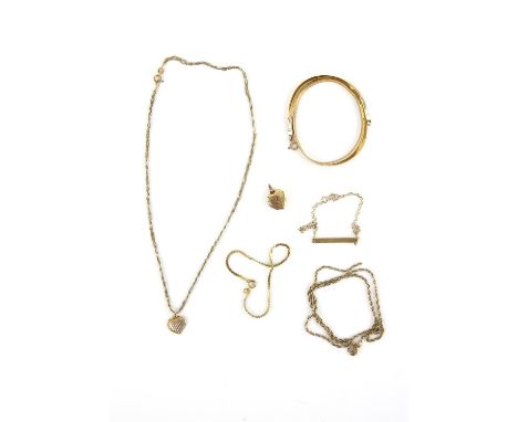 A group of gold jewellery, including a heart locket, a bi coloured heart pendant on a fancy link chain, a flat link necklace,