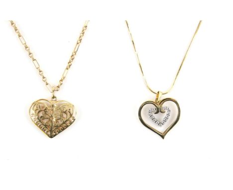 Two heart necklaces, including a filigree puff heart on a fancy link chain, in 9 ct, and a cubic zirconia set double heart, o