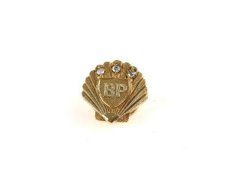 BP diamond set lapel pin, shell shaped pin with three single-cut diamonds and marked BP, in 9 ct gold, hallmarked Birmingham 