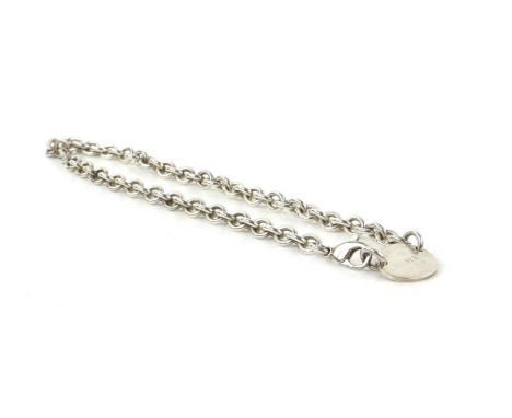 Tiffany & Co necklace, with oval pendant marked 'Please return to Tiffany & Co New York', connected to a belcher link with lo