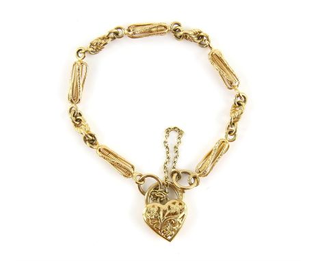 Fancy link charm bracelet, with a floral openwork heart clasp and safety chain, in 9 ct, length 20cmCondition Report:  Gross 