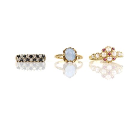 Three gem set rings, including a pearl and garnet cluster ring, hallmarked Birmingham 1994, ring size V, together with an opa