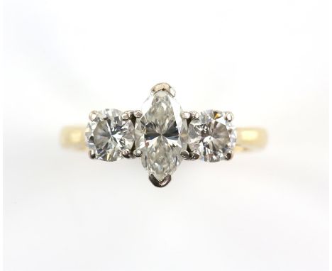 Three stone diamond ring, central marquise cut diamond weighing an estimated 0.88 carat, with a round brilliant cut diamond e