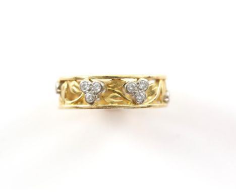 Diamond set floral band ring, tapering band, set with eight round brilliant cut diamonds, in an openwork floral setting, in 1