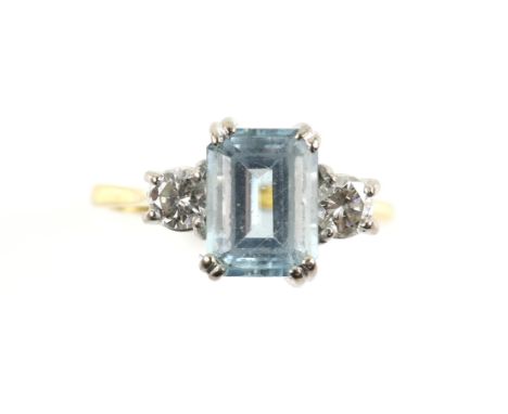 Aquamarine and diamond three stone ring, central aquamarine step cut, estimated weight 2.47 carats, set between two round bri