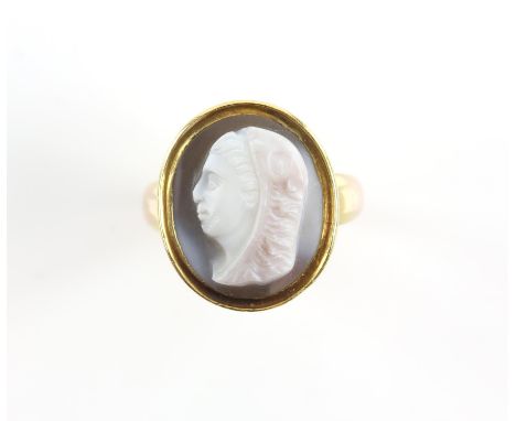 Agate cameo ring, carved cameo depicting the profile of a lady, in a closed back setting with a tapering band, tested as 18 c