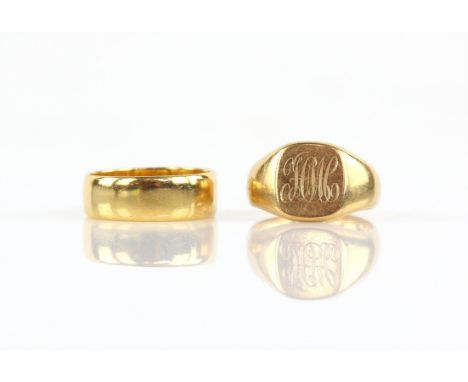 Two gold rings, including a signet ring with an engraved monogram, mounted in 18 ct, hallmarked Chester, ring size J and a 6.