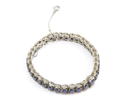 Sapphire and diamond bracelet, with graduating round cut sapphires, in articulated links, with round brilliant cut diamond de