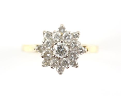 Diamond daisy cluster ring, set with round brilliant cut diamonds, weighing an estimated total of 0.80 carat, claw set, mount
