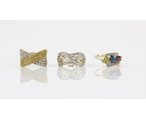 Three diamond dress rings, including a multi-row diamond crossover ring, ring size P, a yellow and white diamond crossover ri
