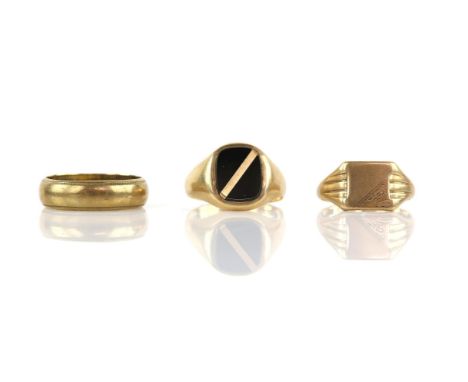 Three gold rings, including an onyx and gold signet ring, size R, an engraved gold signet ring, size Q, and a 6mm wedding ban