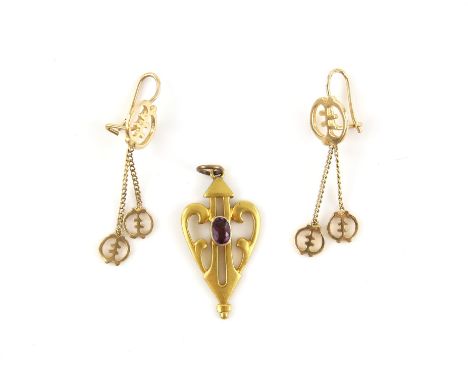 Gold pendant, centrally set with an oval cut garnet, mount testing as 18 ct, 3.5 x 1.7cm, with jump ring bail and a pair of g
