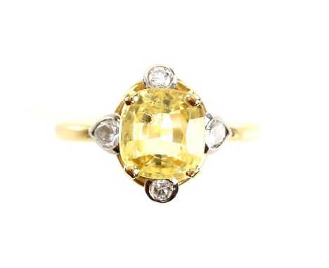 Yellow sapphire and diamond dress ring, central cushion cut yellow sapphire, estimated total weight 3.28 carats, with two rou