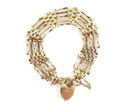 Vintage gate bracelet, with an engraved heart padlock clasp, hallmarked 9 ct, London 1964, with a safety chain, length approx