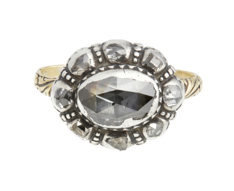 A Georgian diamond set cluster ringcirca 1810, the rose-cut diamond within an old-cut diamond border, closed set to a plain r