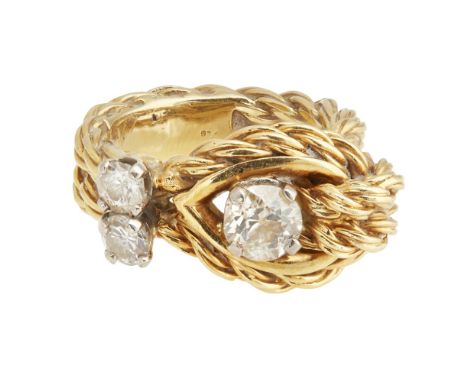 An 18k gold diamond set ring, Kutchinskyof knotted rope-twist design, asymmetrically claw set with three round cut diamonds, 