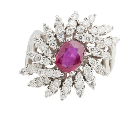 A ruby and diamond set cluster ringclaw set with an oval mixed cut ruby, in a surround of radiating round brilliant cut diamo