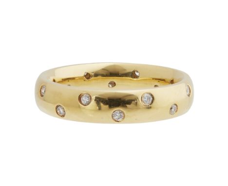 A diamond set eternity ringgypsy set with sixteen round brilliant cut diamonds, the inside of the band stamped 750Ring size: 