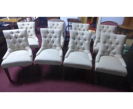 A set of 8 contemporary dining chairs, with button back stone linen upholstery 