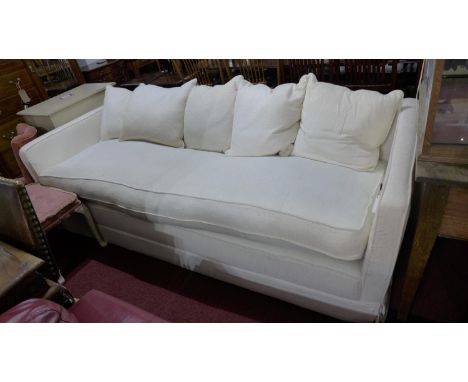 A large contemporary 4 seat sofa, in a cream upholstery 