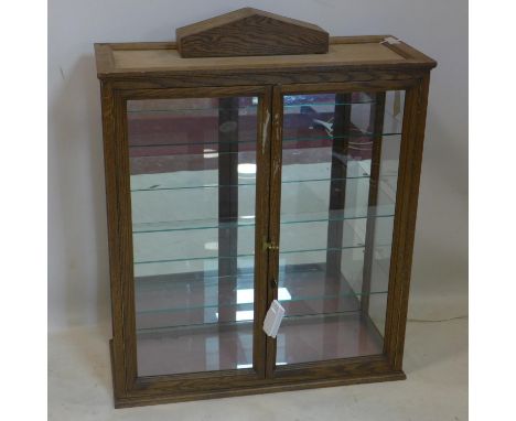 A 20th century oak display cabinet, with mirrored back and internal lighting, H.93 W.76 D.31cm 