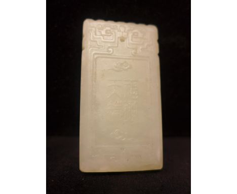 A Chinese celadon jade panel, decorated to obverse with figure and bat and to reverse with Chinese characters, 5 x 2.5cm 