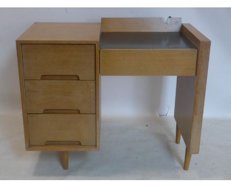 A mid 20th century light oak desk, raised on tapered legs, H.78 W.89 D.46cm 