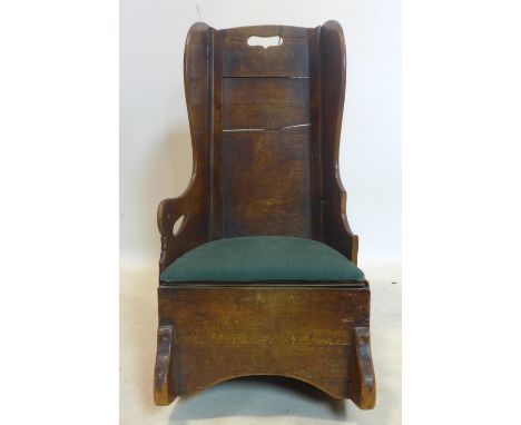 An early 19th century oak child's rocking commode 