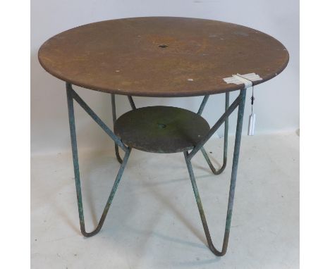 A vintage French wrought iron garden table, raised on hair pin legs, H.80 D.94cm 