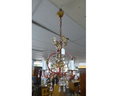 A small vintage red and gilt painted metal chandelier 