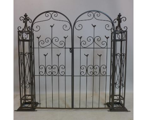 A contemporary metal garden gate, with pierced bird and scrolling design, H.121cm 