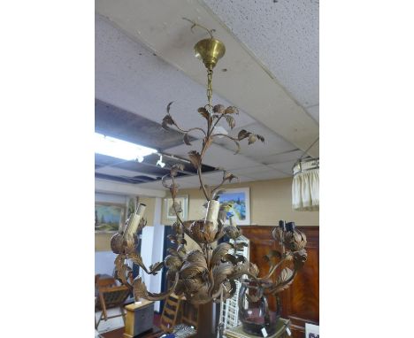 A vintage 7 branch metal chandelier with leaf decoration 