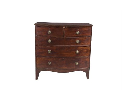 A GEORGE IV MAHOGANY BOWFRONT CHEST on two short and three long graduated cockbeaded drawers with brass ring handles and rais