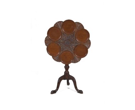 A GEORGE III STYLE MAHOGANY LOBED CIRCULAR SNAP-TOP SUPPER TABLE, the centre carved with foliate motifs within six dished dis
