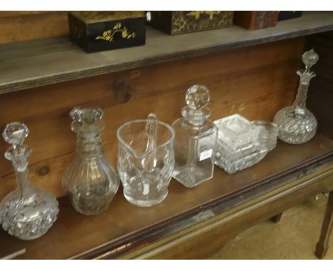 AN EDWARDIAN SQUARE-CUT DECANTER with angled corners and fitted with globular facet cut stopper; together with a set of five 