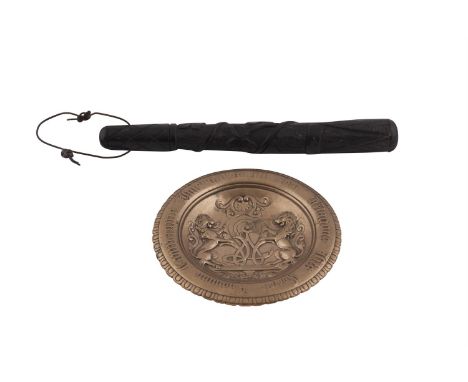 AN IRISH VICTORIAN CARVED BOG OAK TRUNCHEON, with leather wriststrap, trellis incised handle and body carved with Celtic harp
