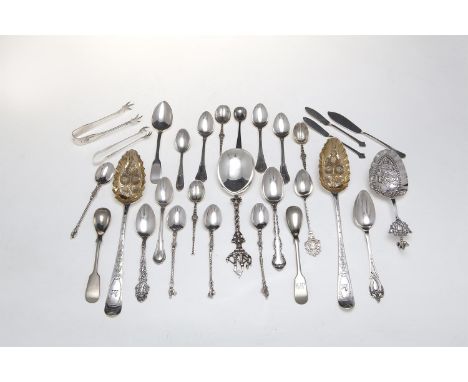 A MISCELLANEOUS COLLECTION OF SILVER FLATWARE, comprising berry spoons, apostle spoons, souvenir spoons, teaspoons, sugar ton