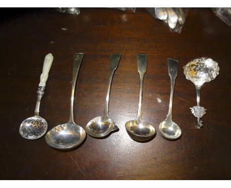 A MISCELLANEOUS COLLECTION OF SILVER LADLES, various dates and makers; together with a mother of pearl handle silver sifting 