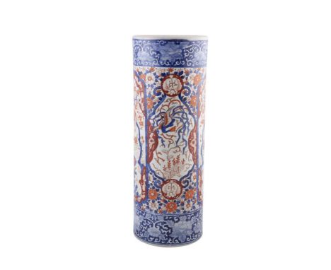 A JAPANESE IMARI PORCELAIN CYLINDRICAL STICK STAND, c.1900, decorated in blue, brick red and white tones. 61cm high