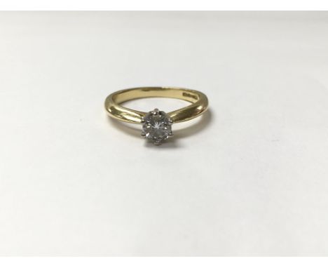 An 18ct gold ring set with 0.25ct diamond. The approximate ring size is K.