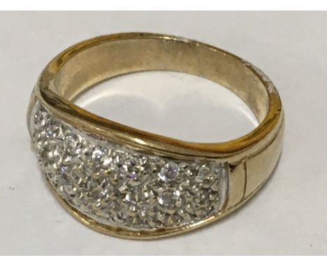 A Pave set bombe-style ring in yellow gold. Ring size O