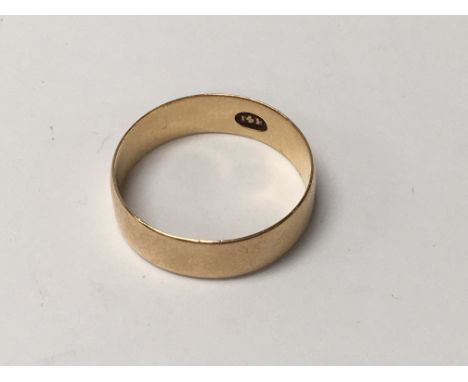 A 14 k gold wedding band ring 3 grams .